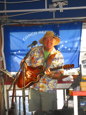 island bill performing at billy's stonecrab bar