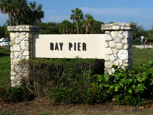 the bay pier sign is your landmark for parking at fort desoto dog beach