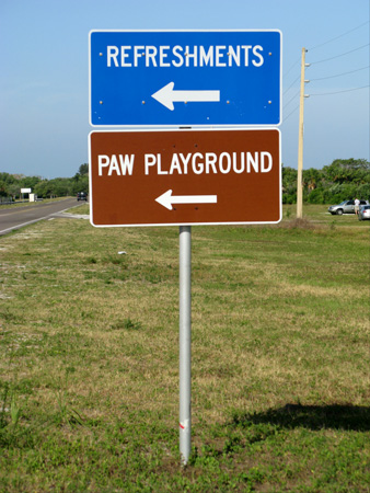 paw playground sign for parking at fort desoto dog beach