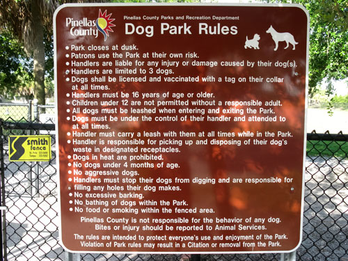paw playground rules sign for the fort desoto dog beach park