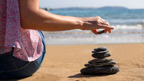 Stacking rocks on the Florida beach is a timeless tradition of peace and connection.