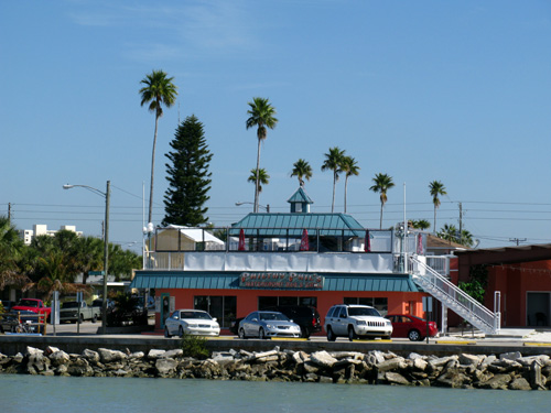 sunset beach boardwalk looking at philthy phils beach bar