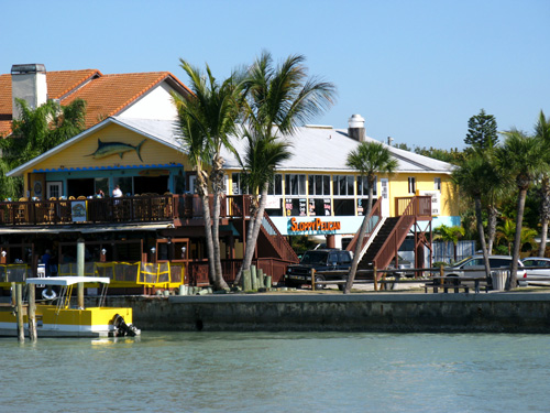 sunset beach boardwalk looking at the sloppy pelican saloon