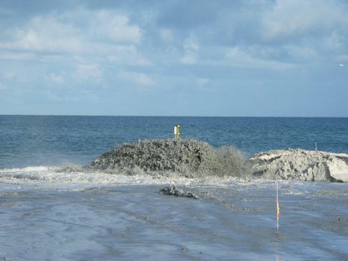treasure island beach renourishment belching flow pipe on sunshine beach running on full