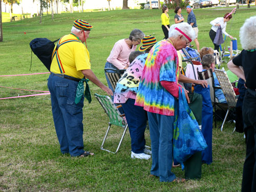 american stage in the park, st petersburg fl, customers in hippie garb set up their seats