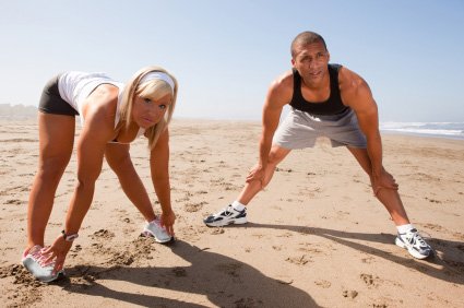 beach workout couple warming up