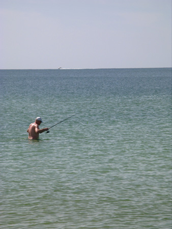 A fisherman gets ready to try his luck off Treasure Island Beach