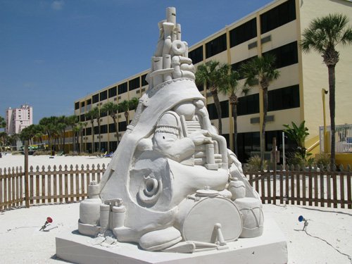 sloppy joes sand sculpture seen from the side where slight erosion is taking place