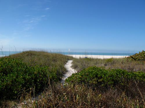 sunset beach boardwalk path to blind pass jetty