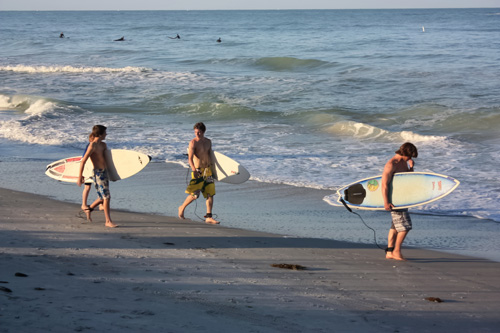 sunset beach surfers