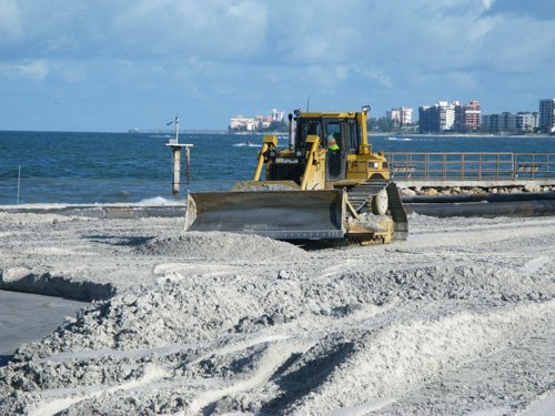 treasure island beach renourishment bulldozer grading down sand pumped from the Gulf